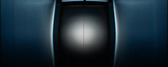 The Severance elevator, its doors closing on a bright light.